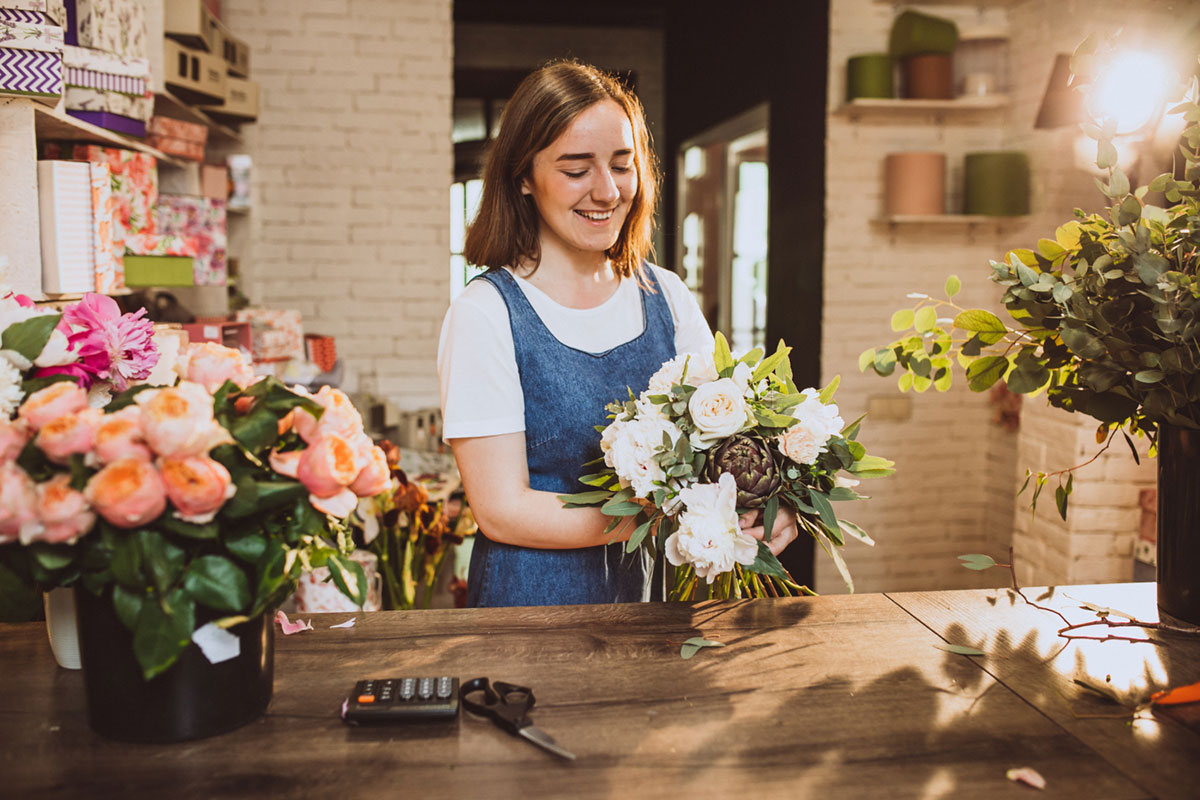 Woman arranging flowers in a florist